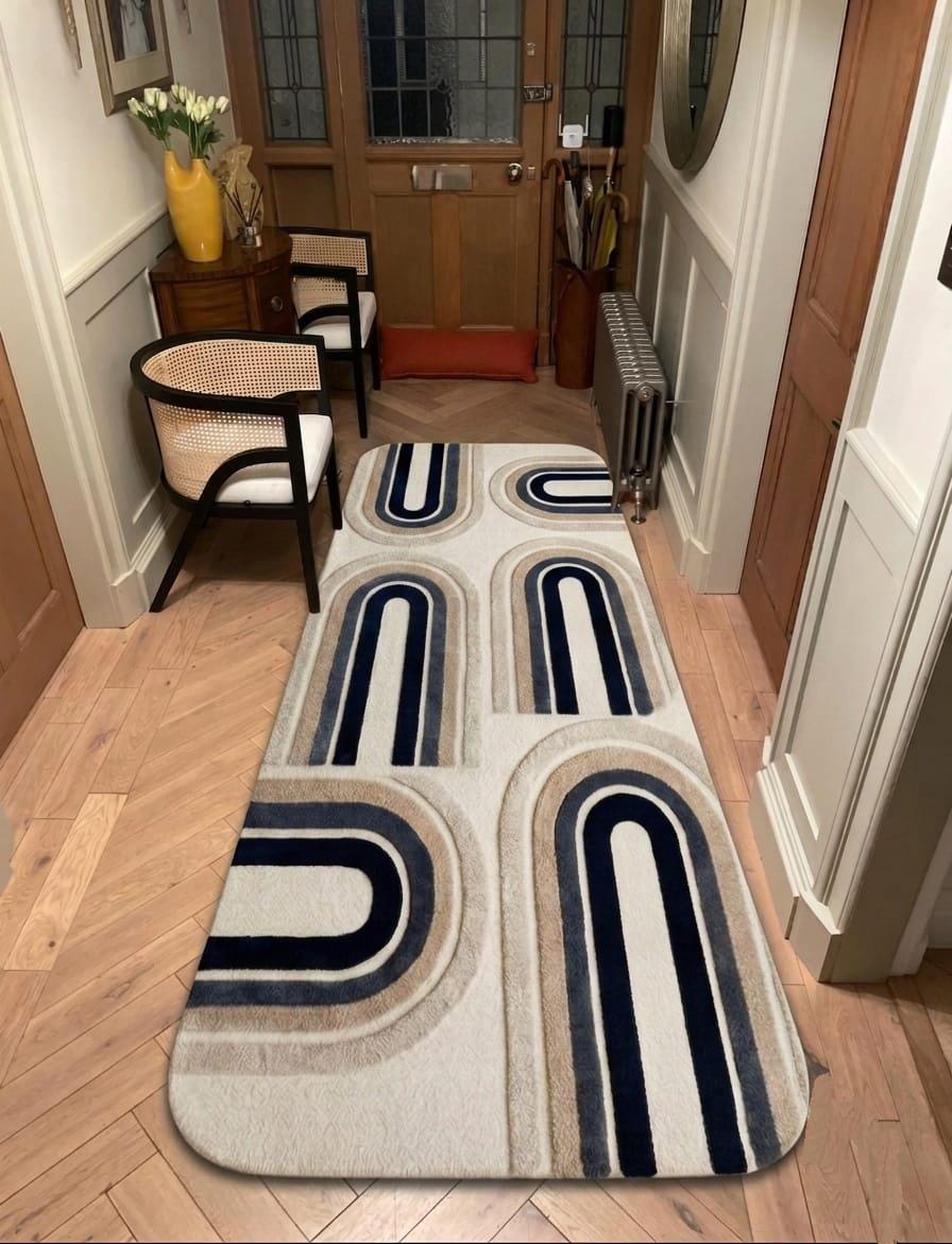 Shubham-Art-Rugs-hand-tufted-new-zealand-wool-arch-rug-navy-blue-beige-ivory-contemporary-carpet A long rectangular area rug with a mid-century modern geometric arch pattern in navy blue, beige, and cream, shown on a light wood herringbone floor in a hallway.