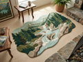  Shubham-Art-Rugs-hand-tufted-new-zealand-wool-mountain-landscape-rug-organic-forest-river-design-3d-sculpted-silhouette A large, irregularly shaped area rug featuring a detailed mountain and river landscape design, styled on a light wood floor in a cozy room setting near a fireplace and wooden tables.
