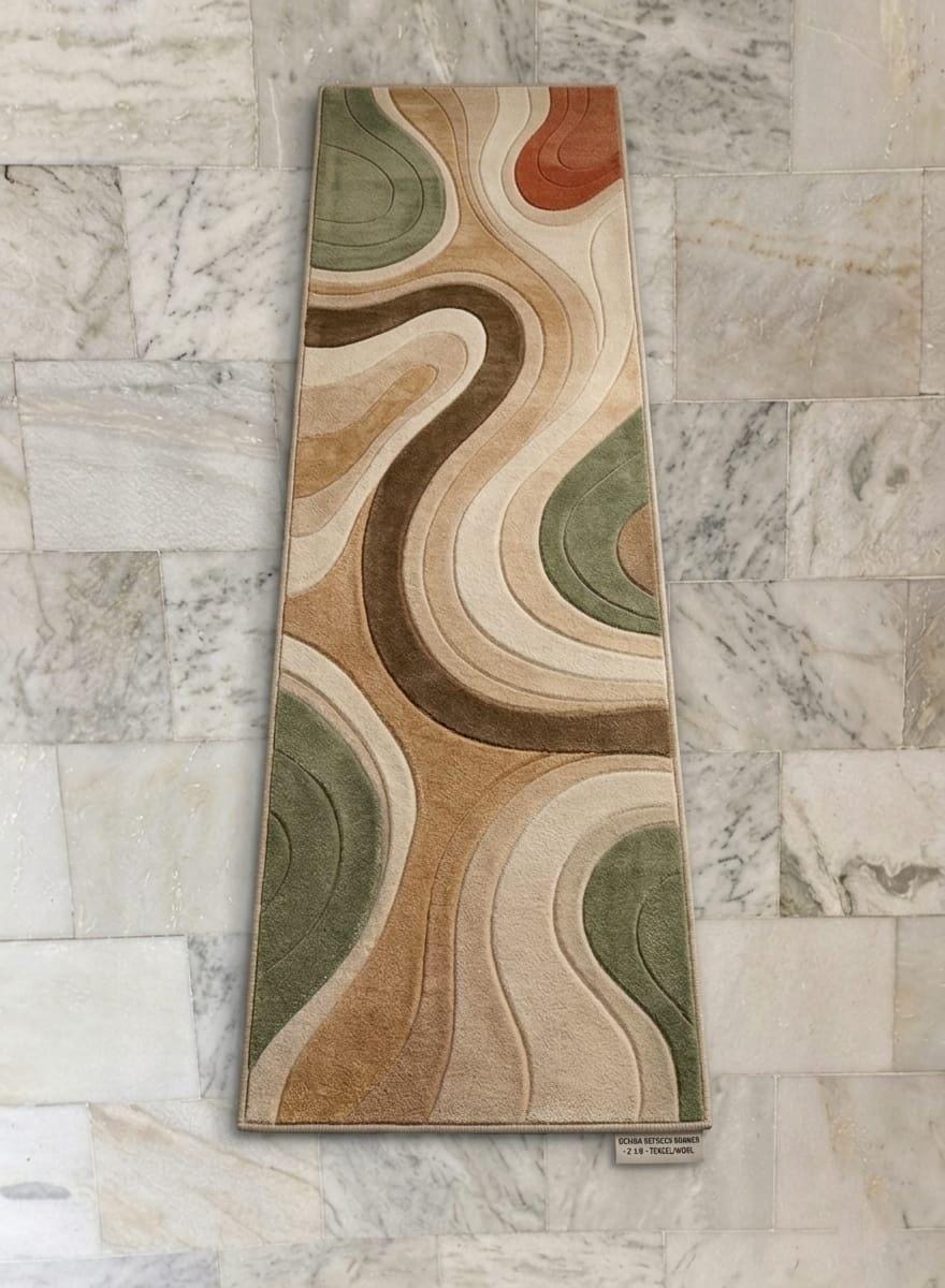 Modern-organic-living-room-interior-decorated-with-sage-green-and-terracotta-abstract-wavy-area-carpet  A long rectangular area rug with an abstract wavy contour pattern in beige, brown, green, cream, and rust orange, displayed against a light marble tile wall.