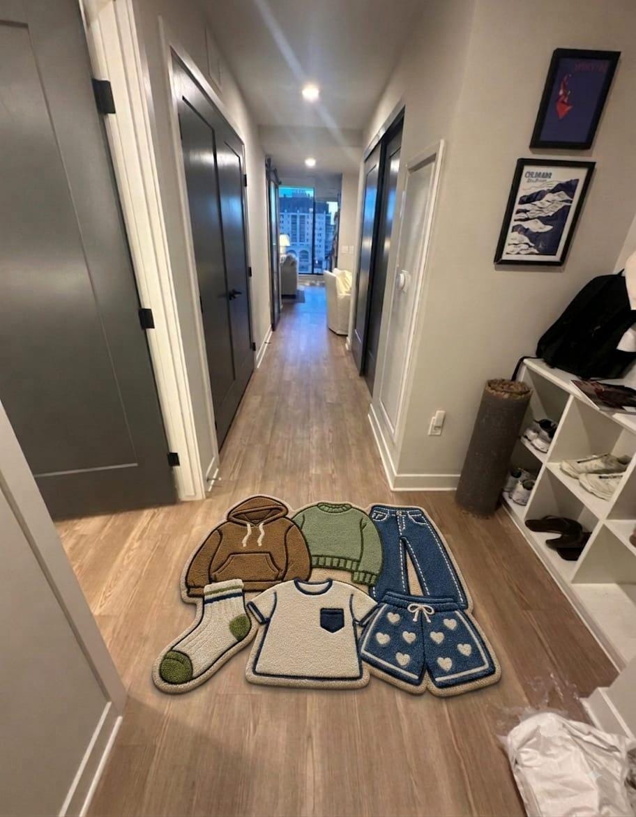 Shubham-Art-Rugs-hand-tufted-wool-clothes-pile-rug-pop-art-hypebeast-room-decor-custom-carpet
A set of five cozy, flat-lay style floor mats shaped like matching clothing and accessories, displayed on a light wood hallway floor in a home setting.