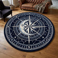Shubham Art Rugs hand tufted New Zealand wool celestial compass rug featuring a mystical moon and stars astrology design layout
 A round navy blue rug with a white celestial compass design featuring a moon face, stars, constellations, and directional symbols, displayed on a wooden floor in a living room setting.